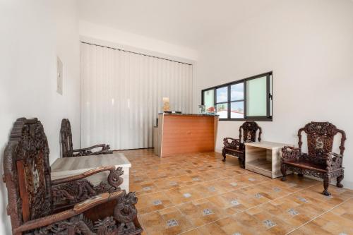 a living room with two chairs and a table at Xiao San Chill in Xiaoliuqiu