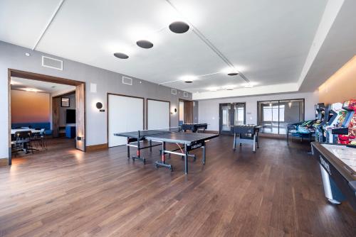 a large room with a ping pong table in it at Pioche Village Park City in Park City