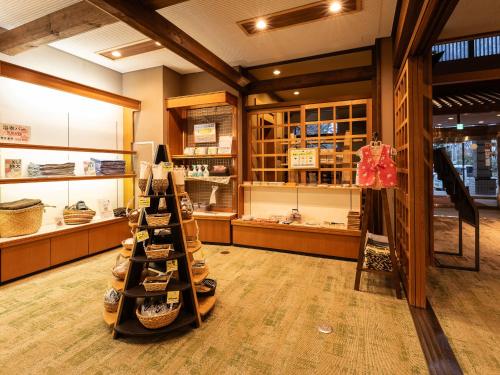 a store with a rack of shoes in a store at Ryokan Gizan in Takayama