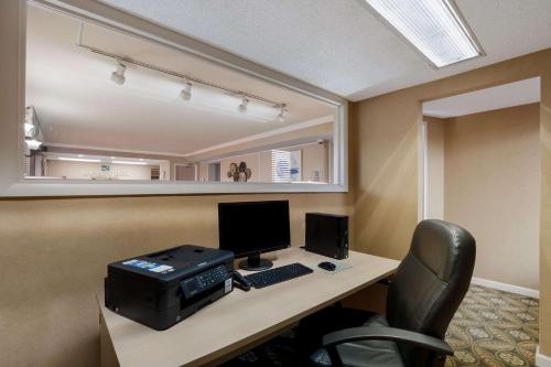 an office with a desk with a computer and a printer at Quality Inn Fort Jackson in Columbia