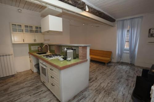 Kuchyň nebo kuchyňský kout v ubytování Un Incanto Chic nel Borgo