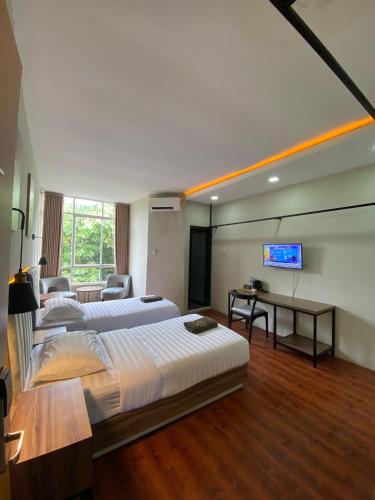 Katil atau katil-katil dalam bilik di Royal Kencana Hotel powered by Cocotel