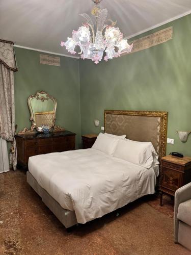 Ένα ή περισσότερα κρεβάτια σε δωμάτιο στο Hotel Guerrato