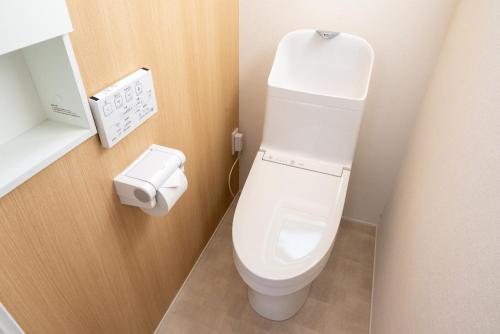a bathroom with a white toilet in a room at ライトハウス旭川 in Asahikawa