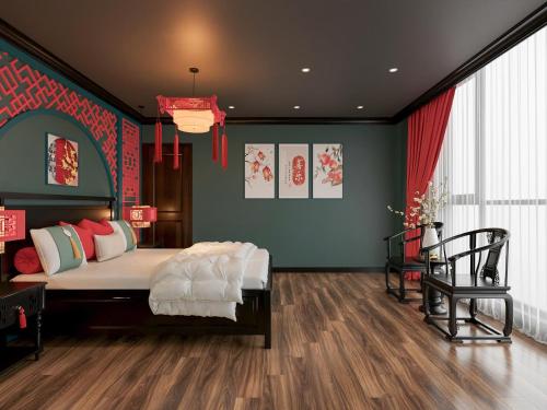 a bedroom with a large bed with red and green walls at Dal Vostro Vinhomes Ocean Park 2 in Ðình Loan