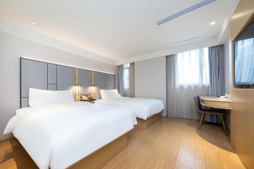 Letto o letti in una camera di Ji Hotel (Shanghai Bund Ningbo Road)