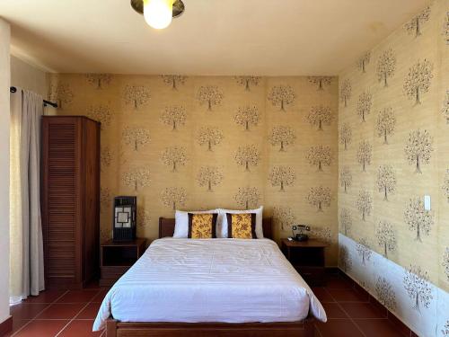 Cama o camas de una habitación en Melon Resort & Pickleball Club Mũi Né