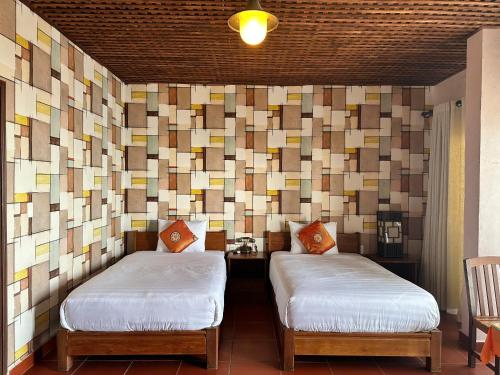 Cama o camas de una habitación en Melon Resort & Pickleball Club Mũi Né