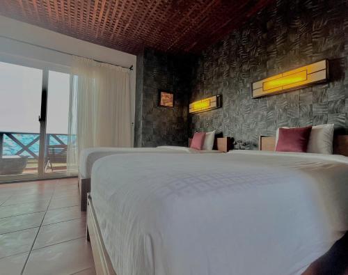 Cama o camas de una habitación en Melon Resort & Pickleball Club Mũi Né