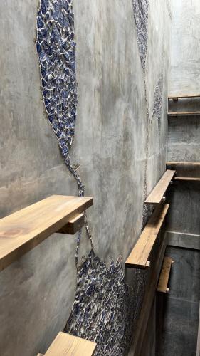 a stairway with a chain attached to a wall at Ci home in Pom Prap