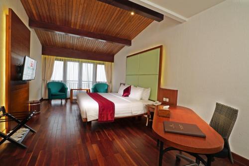 Voodi või voodid majutusasutuse Puncak Pass Resort toas