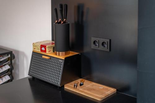 a table with a container with some tools on it at KOREK Mikulov apartmán in Mikulov