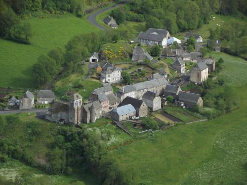 an aerial view of a village on a hill at gite au creux de la Vallée in Brezons