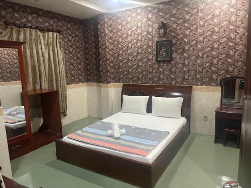 Katil atau katil-katil dalam bilik di Ngọc Hương Hotel
