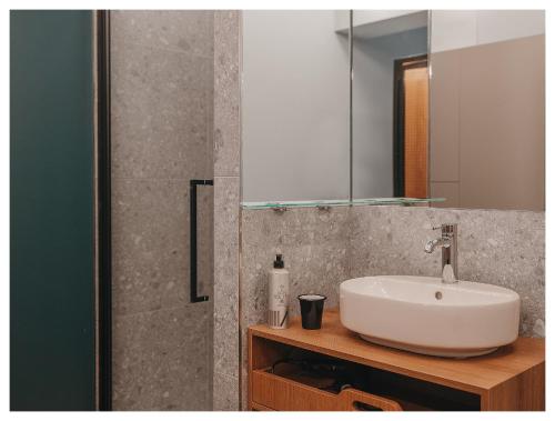 a bathroom with a sink and a mirror at 1.75 Paris Le Charme in Paris