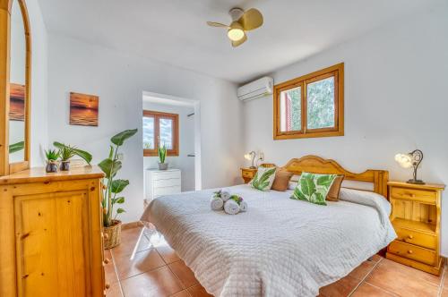 Ένα ή περισσότερα κρεβάτια σε δωμάτιο στο Ideal Property Mallorca - Ca Na Venta