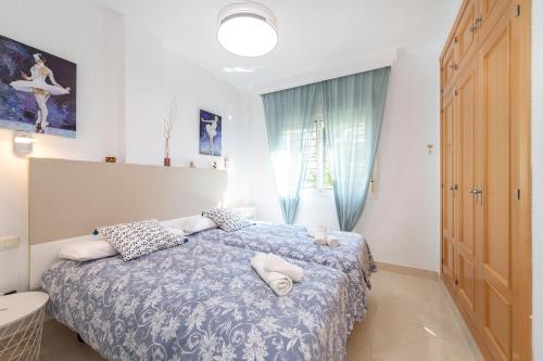 Posteľ alebo postele v izbe v ubytovaní APARTAMENTO AÑORETa 113