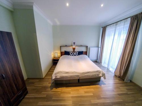 Posteľ alebo postele v izbe v ubytovaní Apartmany Orava