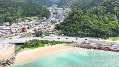 an aerial view of a beach and a highway at ヤンバルハウスクイナ in Nago