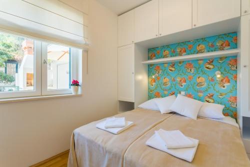 Llit o llits en una habitació de Apartment Lividus A7