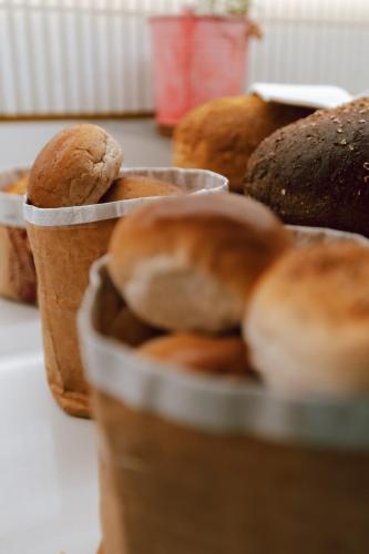 a bunch of different types of bread on a table at Radisson Blu Hotel Amsterdam Airport, Schiphol in Schiphol