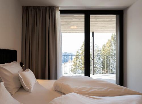 Postel nebo postele na pokoji v ubytování Familienhotel Maria