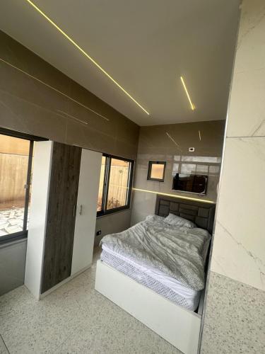 a bedroom with a bed in a small room at the royal occasion amman in Amman