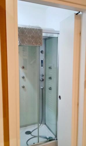 a mirror in a bathroom with a shower at Casa Giannina in Germignaga
