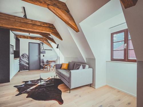 a living room with a couch and a table at Mariandl im Oberwirt in Eggenfelden