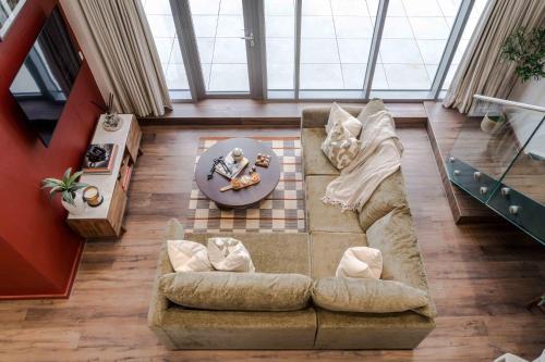 an overhead view of a living room with a couch at Waterside Living I Luxe Apartments in Bristol
