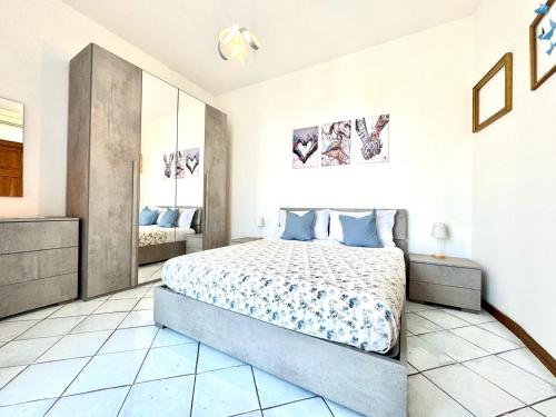 a bedroom with a large bed in a room at Over the Rainbow in Sant'Agnello