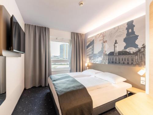 Postel nebo postele na pokoji v ubytování B&B HOTEL St-Pölten