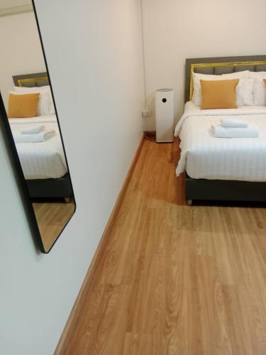 Un ou plusieurs lits dans un hébergement de l'établissement The 5ive Homestay