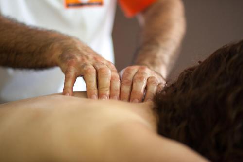 a man getting his hair washed at a salon at Casas Novas Countryside Hotel Spa & Events in Chaves