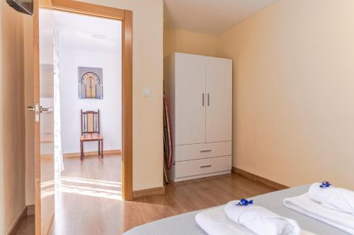 Posteľ alebo postele v izbe v ubytovaní La Casita de la Plaza