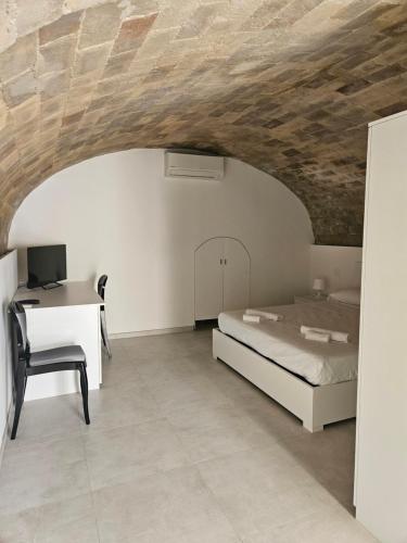 Letto o letti in una camera di La Stanza di Chiara