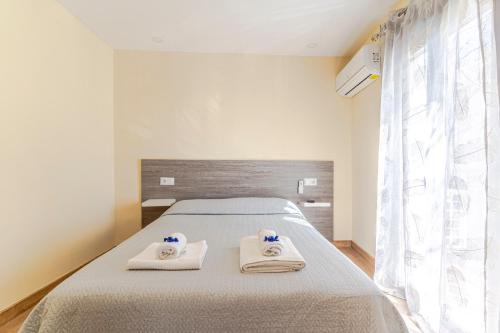 Posteľ alebo postele v izbe v ubytovaní La Casita de la Plaza