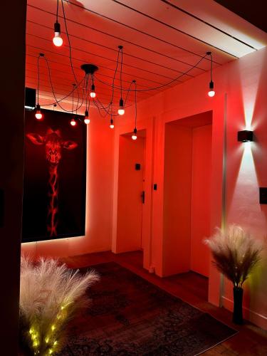 a room with a painting of a giraffe on the wall at Loveroom en bords de Meuse in Floing