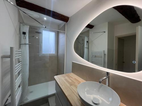 a bathroom with a sink and a mirror at Superbe T2 Bolquère in Bolquere Pyrenees 2000