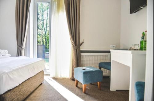 En eller flere senge i et værelse på Vila Savka