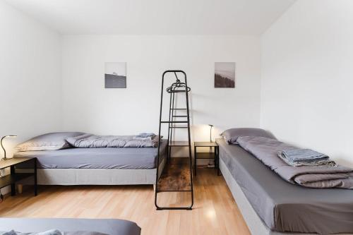 Katil atau katil-katil dalam bilik di feworld living - Linz Wasserwald