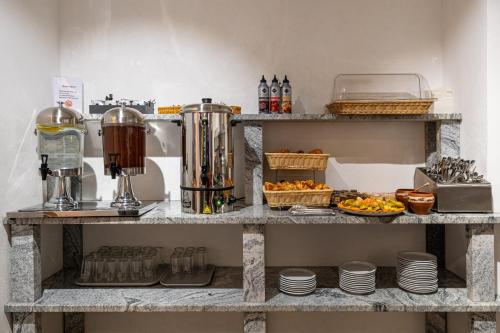 a shelf with a blender and some food on it at Milli&Jon SPA in Bukovel