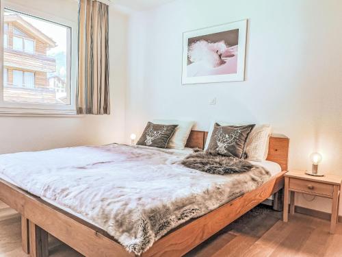 Giường trong phòng chung tại Apartment Residence Chateau B-2 by Interhome