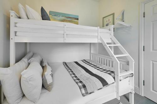 a white bunk bed with a ladder in a room at Host & Stay - Fox's Hideout in Whitby