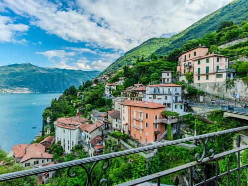 a view of a town on the side of a mountain at Apartment Vista Cascata by Interhome in Nesso