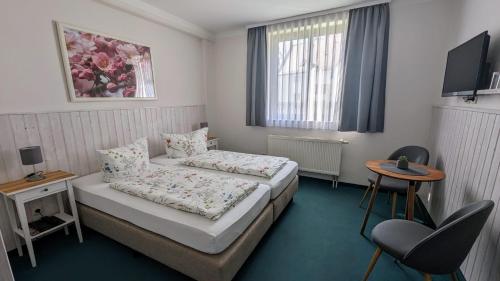 Postel nebo postele na pokoji v ubytování Pension Am Kirschberg