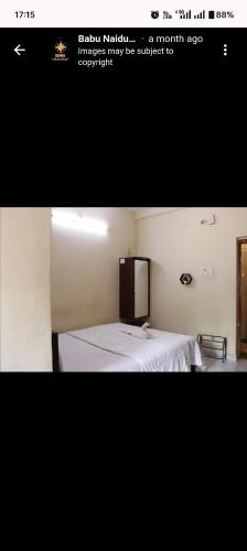 a picture of a bedroom with a bed in a room at Babu naidu residency BNR in Vellore