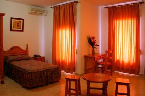 Postel nebo postele na pokoji v ubytování Hotel Limas
