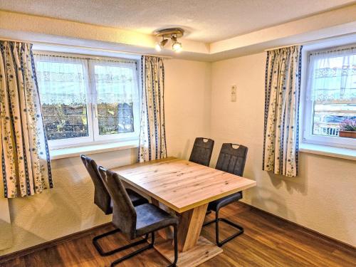 a dining room with a wooden table and chairs at Apartment Venet by Interhome in Wenns