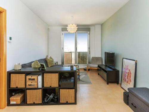 a living room with a couch and a table at Apartment Maxxie by Interhome in Benicarló